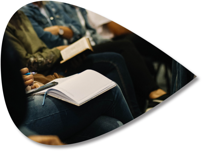 Participants taking notes in a workshop